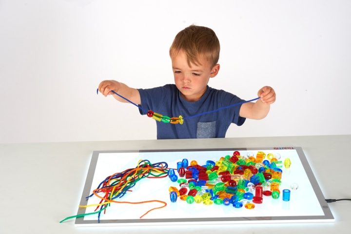 Boy Stringing Beads